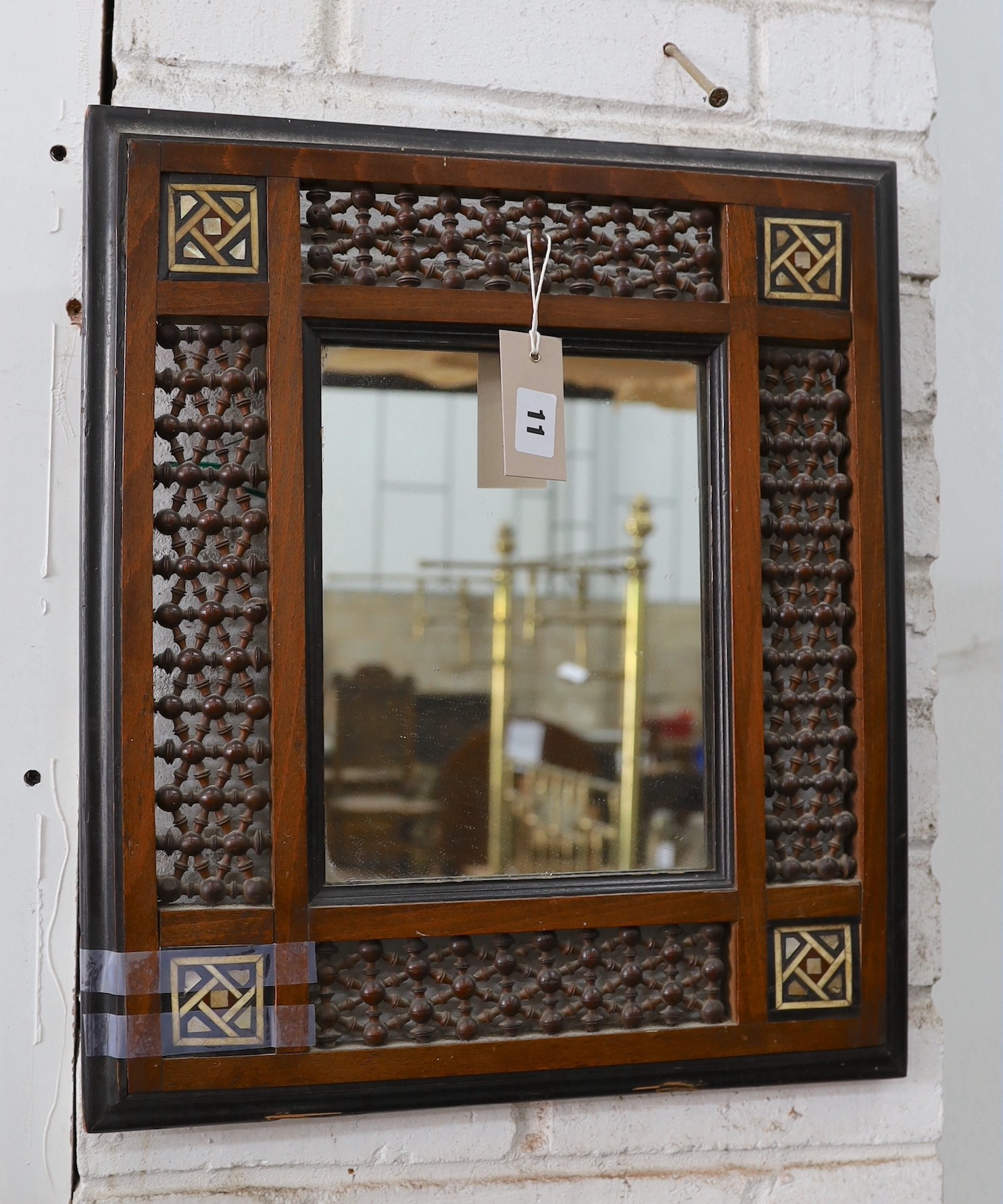 A Moorish mother of pearl inlaid wall mirror, width 41cm, height 47cm
